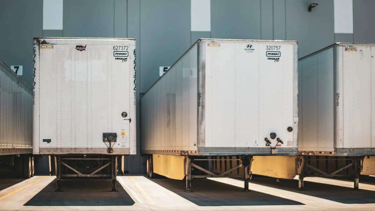 White trailers lined up at warehouse loading docks